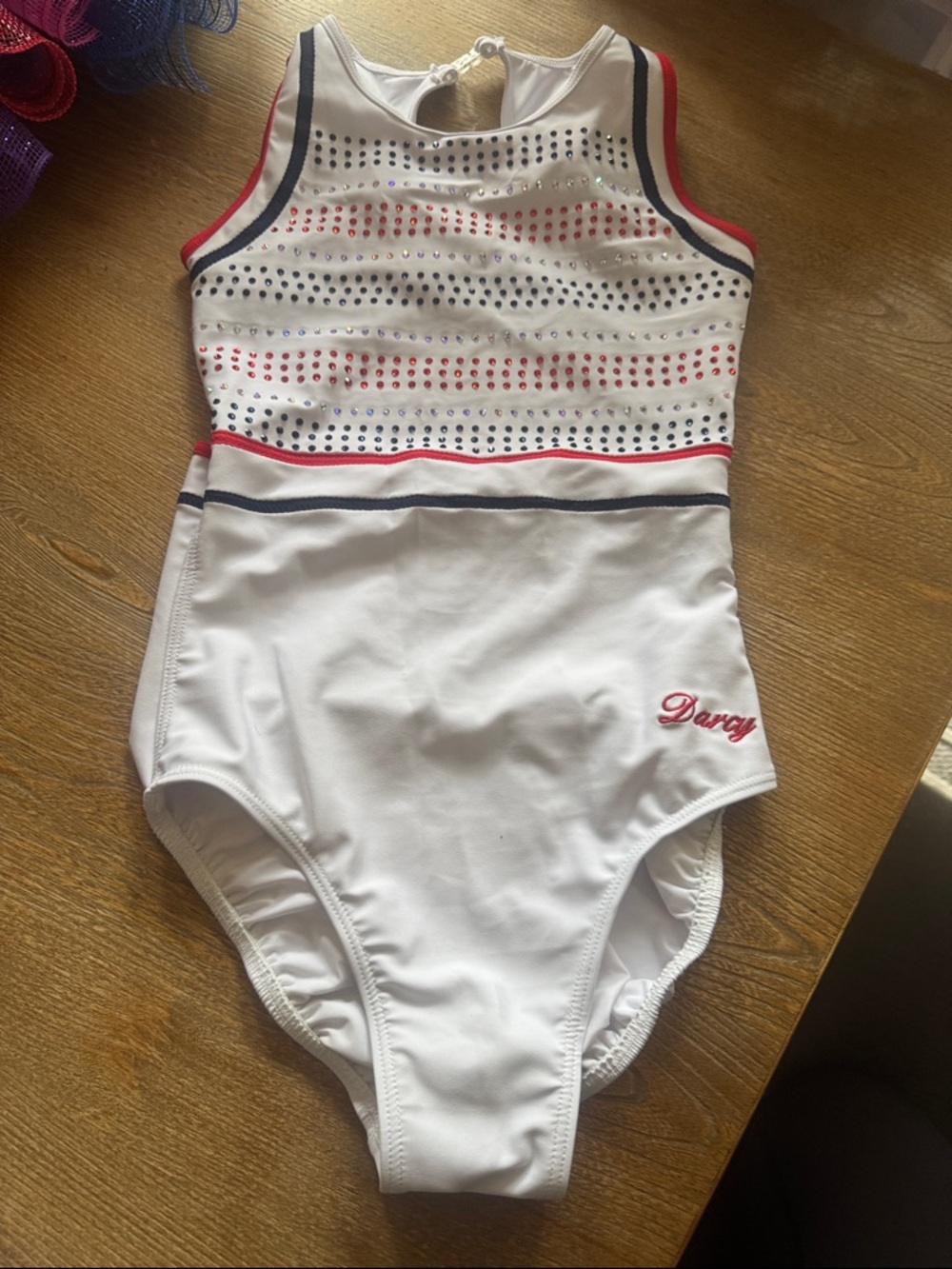 Darcy white Leo with red and blue accents & rhinestones size AM